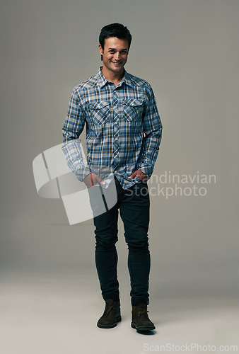 Image of Happy man, portrait and fashion with style or trendy clothes on a gray studio background. Handsome male person or young model with casual clothing or stylish outfit in confidence on mockup space