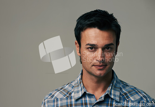 Image of Serious, fashion and portrait of man on gray background with confidence, pride and attitude. Mockup space, model and face of isolated person with trendy clothes, casual outfit and style in studio