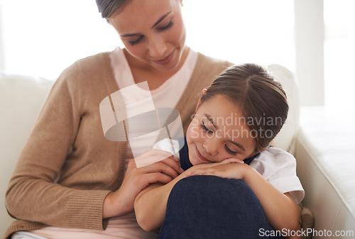 Image of Family, mother and sleeping child on couch for rest, love and care with security, comfort and bonding in support. Happy woman, young girl and dream during nap with peace, relax and trust at home