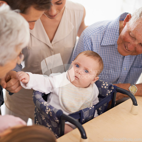 Image of Parents, grandparents and baby with portrait in home with bonding, security and healthy development. Family, men and women or infant in high chair with serious face, vulnerable and parenting in house