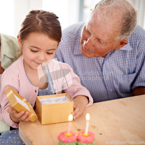 Image of Grandfather child and open gift box, birthday party with celebration for special event and happy family at home. Old man with young girl, unboxing present with gratitude and cupcake for dessert