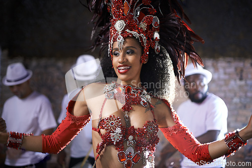 Image of Artist, dancer and performance of samba by woman in Rio de Janeiro, happiness and celebration with energy. Female person, culture and clothes from feather for fashion in carnival, music and Brazil