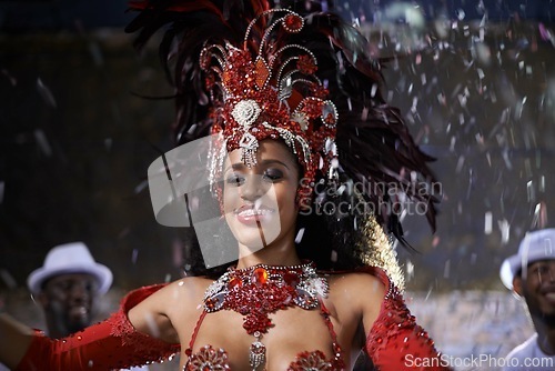 Image of Samba, woman and dancing with band at carnival in rio de janeiro for brazilian festival with feather costume or happy. Dancer, face or night with energy, fashion or music for culture or outdoor event