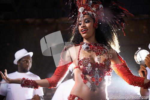 Image of Black woman, samba performance with band at night for carnival season celebration in Rio de janeiro with sequins costumes. Female person, happy and dancing at festival with unique fashion for culture