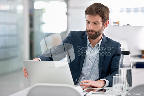 Image of Laptop, reading and businessman in office for research on company finance or budget project. Technology, career and male financial advisor working with computer on corporate account in workplace.