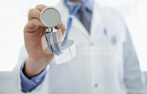 Image of Doctor, hand and stethoscope or cardiology consultation or heart rate listening for healthcare, wellness or treatment. Medical person, equipment and monitor or virus service, diagnosis or examination