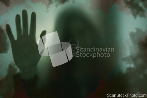 Image of Indoor, biohazard and person with hand on window with scary, danger or zombie trapped in home. Dark, horror and person with creepy aesthetic from virus, risk and sign on glass warning of toxic threat