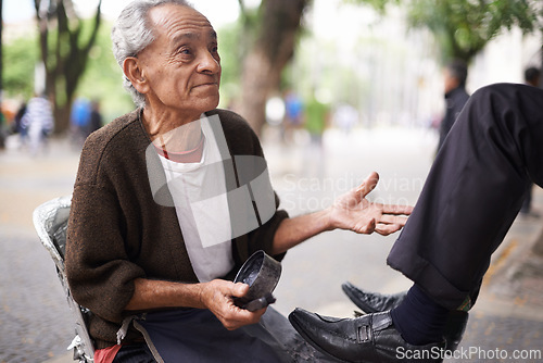 Image of Man, shoes and shining leather or cleaning service on city street or corporate customer with polish, grease or job. Person, brush and business in downtown Sao Paulo or shine footwear, wax or outdoor