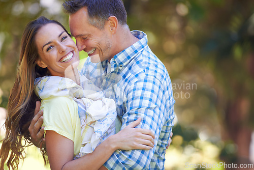 Image of Couple, portrait and bonding with love in garden together, hug and romance for relationship with commitment. Man, woman and affection for dating with care, happy and spouse for comfort in nature