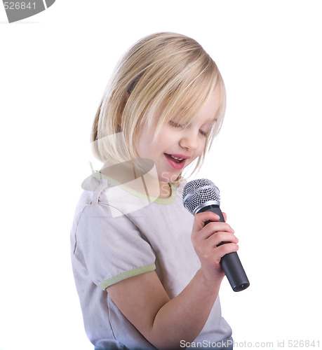 Image of Child Singing Into Microphone