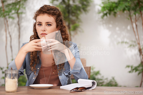 Image of Woman, thinking and coffee at cafe outdoor with idea and book for day dream and stare. Young female person, bistro and vision with cappuccino, journalist and contemplate at breakfast or lunch