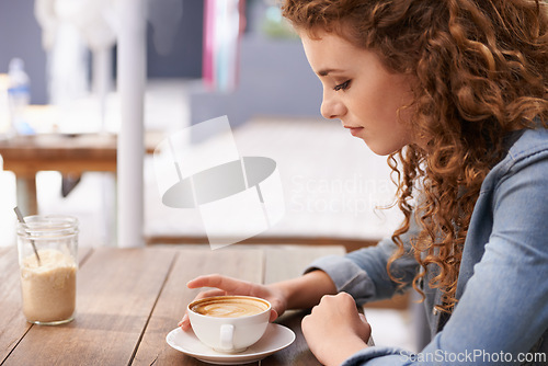 Image of Woman, thinking and coffee at outdoor cafe, latte and relax with day dream and idea for job. Female person, bistro and holding cup with cappuccino, peace and contemplate at breakfast or lunch