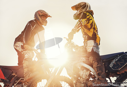 Image of Sport, racer or people on motorcycle outdoor on dirt road with relax after driving, challenge or competition. Motocross, lens flare or dirtbike driver or friends on offroad course or path for sunset