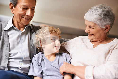 Image of House, smile and grandparents with grandson in lounge, together and love with happiness. Old people, grandmother and grandpa in home as seniors in retirement, elderly and boy in living room