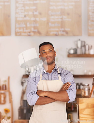 Image of Owner, black man and thinking of cafe for business as entrepreneur, professional and working as barista. Male person, standing and thoughtful of idea for startup of store for coffee in Cape Town