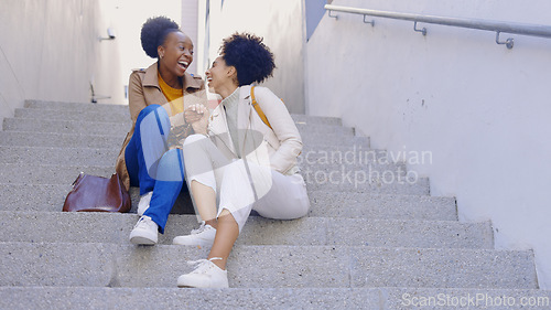 Image of Happy, laugh and women friends on stairs in a city for fun, bonding and hanging out on the weekend. Funny, conversation and people on steps with comedy, gossip or sharing silly, humor or joke outdoor