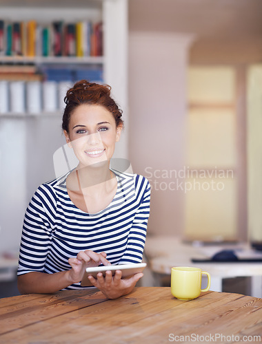 Image of Relax, portrait and woman in home office with tablet, smile and coffee to scroll on social media for business networking. Freelance, remote work and girl at table with digital app for communication.