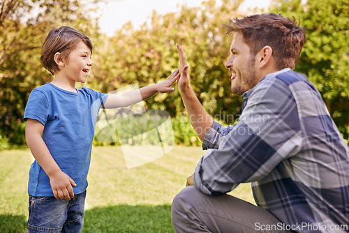 Image of High five, child and dad in park for family adventure, success or motivation with development. Man, boy kid and happy with excited hand gesture for support, teamwork or happiness together in nature