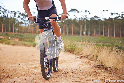 Image of Person, bike and countryside for nature, off road and cycling for health and wellness. Athlete, bicycle and training for workout, transportation and exercise with cape town mountain trail for fitness