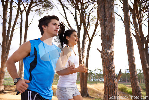 Image of Fitness, forest or couple in nature running for exercise, training or outdoor workout together. People, fast runners or athletes at a park for sports endurance, wellness or cardio challenge in woods