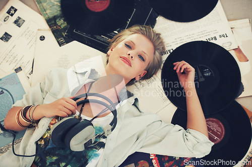 Image of Floor, music and portrait of woman with headphones for streaming subscription, audio and radio. Podcast, smile and above of person listening to playlist, song and track in home with vinyl records