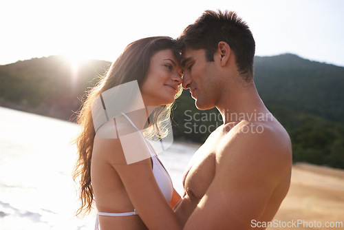 Image of Beach, date and couple with love at on holiday or travel to Bali on vacation in summer. Tropical, island and man with gratitude for happy woman and smile with kindness, care and support together