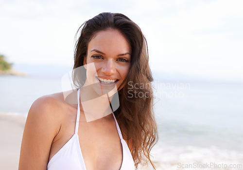 Image of Beach, nature and portrait of woman for travel on tropical vacation, adventure or holiday. Happy, smile and female person with positive attitude by ocean on outdoor summer weekend trip by island.