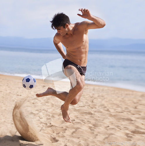 Image of Male athlete, soccer and sand on beach, exercise and training for cardio sports. Bathing suit, football and athletic man on holiday and fun on shoreline, summer and workout and outdoor on vacation