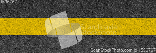 Image of Black asphalt background texture with yellow line. Banner