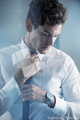 Image of Thinking, tie and getting ready with business man in studio on white background for start of career. Corporate, company and professional with young professional employee dressing for work interview