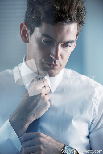 Image of Face, thinking and getting ready with business man in studio on white background for start of career. Corporate, company and professional with serious young employee dressing for interview at work