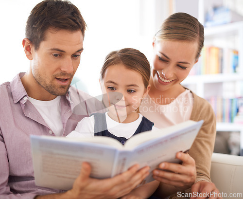 Image of Parents, kid and reading in house, sofa and child development in home schooling and bonding. Mom, dad and toddler on couch, living room and smile while learning in book and fairytale stories together
