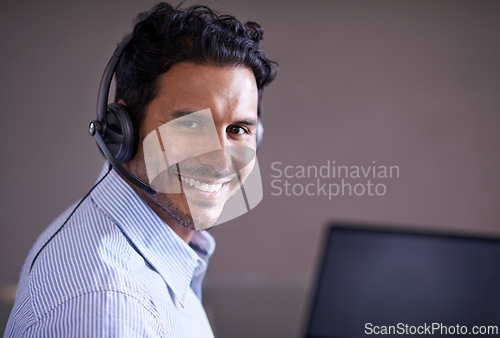 Image of Man, call center and portrait with CRM and smile for tech support, help desk and communication with headset. Customer service consultant, contact us and telecom with mic for telemarketing sales