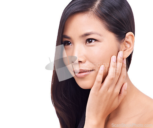 Image of Asian woman, thinking and studio with soft skin for beauty, smile and cosmetics for skincare or routine. Wellness, closeup and hand to feel healthy face with dermatology isolated on white background