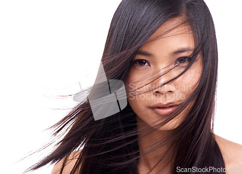 Image of Woman, portrait and wind for hairstyle in studio, beauty and pride for keratin on mockup space. Asian female person, breeze and shampoo for cosmetic on white background, hair treatment and care