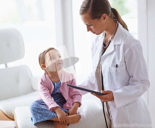 Image of Pediatrician, child and tablet at pediatric hospital for health examination, wellness and support. Medical professional, kid patient and technology in clinic for healthcare, medicine and consult.