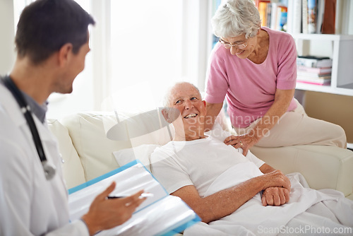 Image of Healthcare, doctor and patient in nursing home for health results, rehabilitation or wellness. Medical professional, consultation and elderly couple for treatment, discussion and positive news.