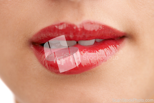 Image of Person, red lipstick and closeup of mouth with makeup for cosmetics, gloss or glow in treatment. Colorful lips of woman or model with bite in satisfaction for mouth, oral or beauty in cosmetology