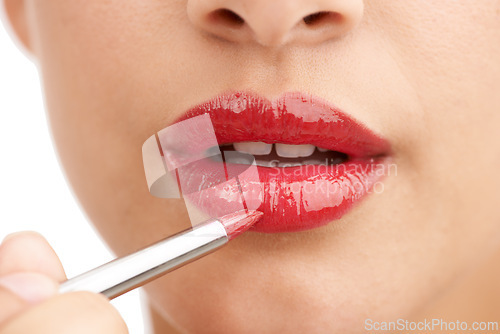 Image of Woman, closeup and red lipstick with makeup for beauty cosmetics on a white studio background. Lips of female person or model applying color, gloss or glow for cosmetology, dermatology or treatment