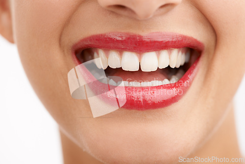 Image of Woman, teeth and red lipstick with makeup for beauty, cosmetics or dental care on a white studio background. Closeup of female person or model with lip gloss, glow or tooth whitening in dermatology