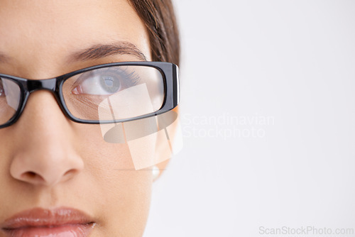 Image of Young woman, thinking and glasses for inspiration and eyecare or optometry in studio mock up. Model, vision and creative idea for career growth, design and planning in spectacles by white background