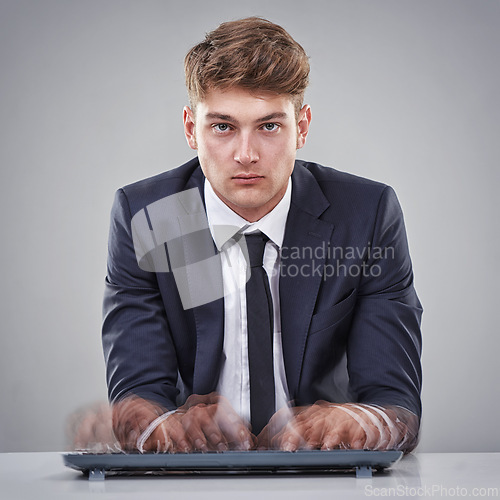 Image of Portrait, hand or businessman for busy, stress or overworked by typing, quick or keyboard in studio. Man, mental health or burnout in corporate, business and fast for office work on grey background