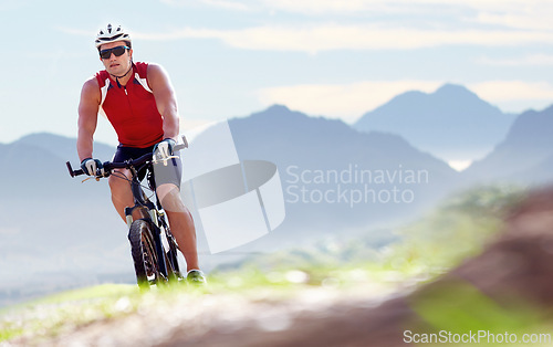 Image of Nature, exercise and man cyclist with bicycle in park for marathon, race or competition training. Fitness, sports and male athlete cycling on bike for cardio health workout outdoor by mountain.