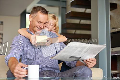 Image of Man, daughter and gift for fathers day in home, happy and present for gratitude or appreciation. Daddy, child and smile for love and care in package for birthday, hug and reading newspaper with tea