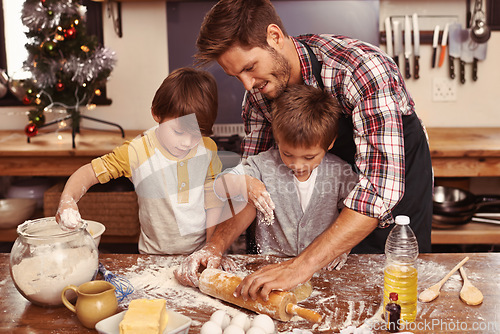 Image of Father, smile and children baking, learning and happy boys bonding together in home. Dad, kids and cooking with flour, rolling pin and teaching brothers with family at table in kitchen for Christmas