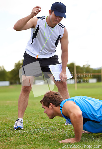 Image of Men, push up and personal trainer on grass for fitness with clipboard for stats, progress or development. Person, coach or mentor with motivation for results, training or workout for health on field