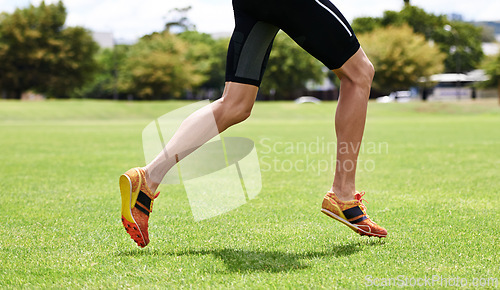 Image of Athlete, run and outdoor for race, legs and activewear in workout and training for wellness and cropped jog. Cardio, wellbeing and sport for exercise, health and fitness on grass for summer shoes
