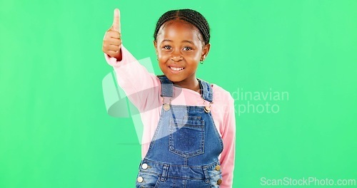 Image of Little girl, face and thumbs up on green screen for good job, approval or success against studio background. Portrait of African American child or kid showing thumb emoji, yes sign or like on mockup