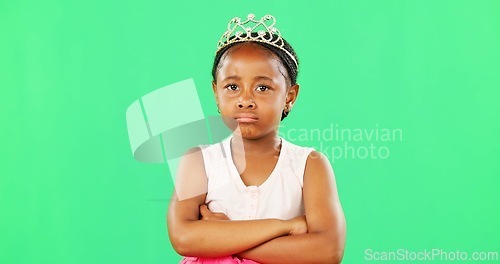 Image of Children, miserable and arms crossed with a black girl on a green screen background in studio. Portrait, tantrum and unhappy with a moody little female child sulking alone on chromakey mockup