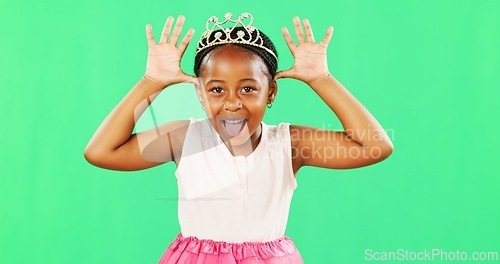 Image of Children, playful and princess with a black girl on a green screen background in studio feeling silly or goofy. Kids, cute and happy with an adorable little girl playing or having fun on chromakey